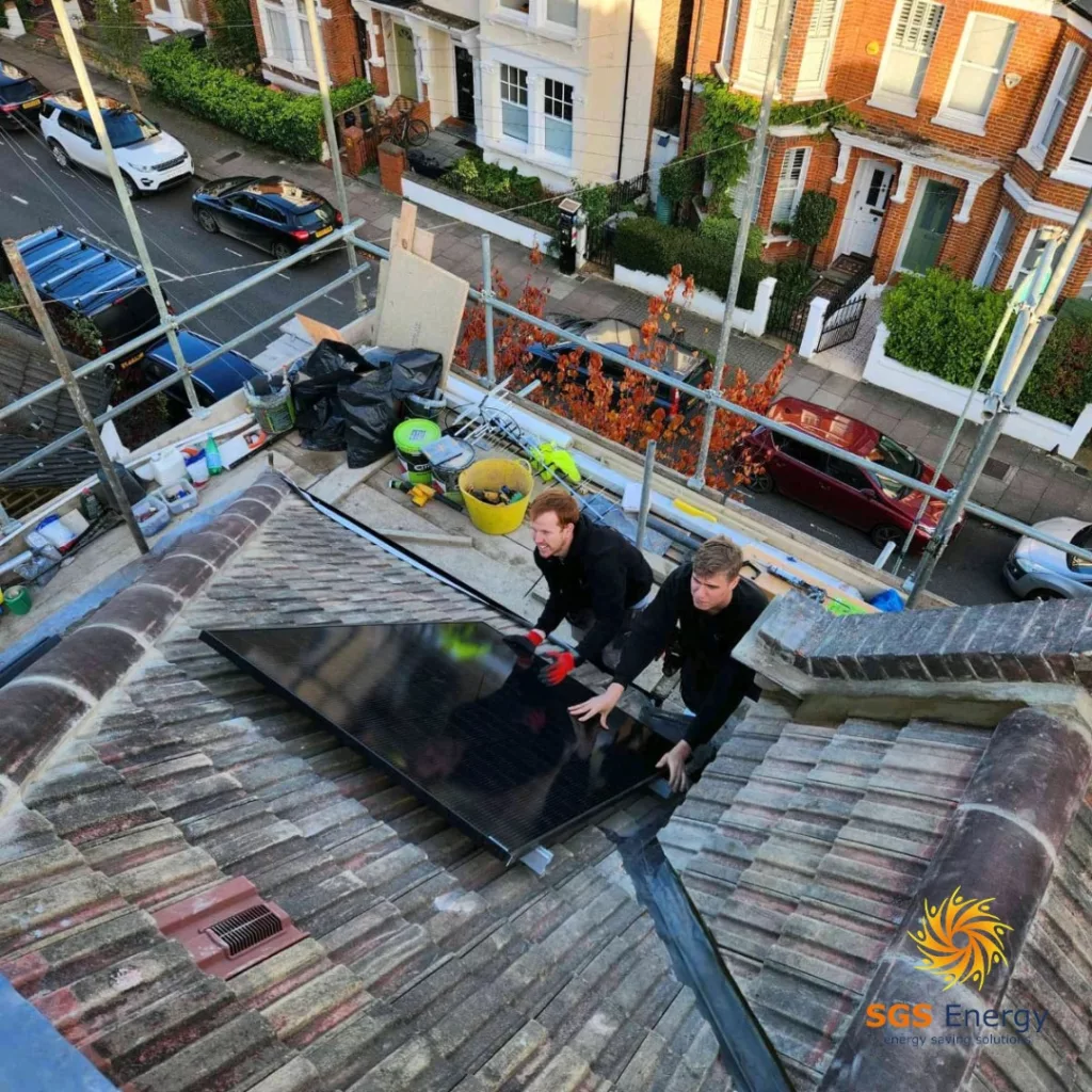 Members of the sgs team installing solar panels in Kent